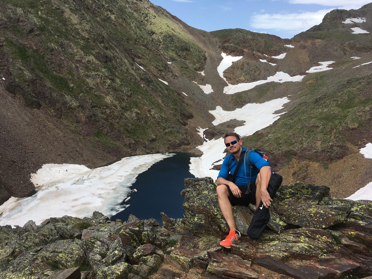 Mountain lake seen from a rocky ridge